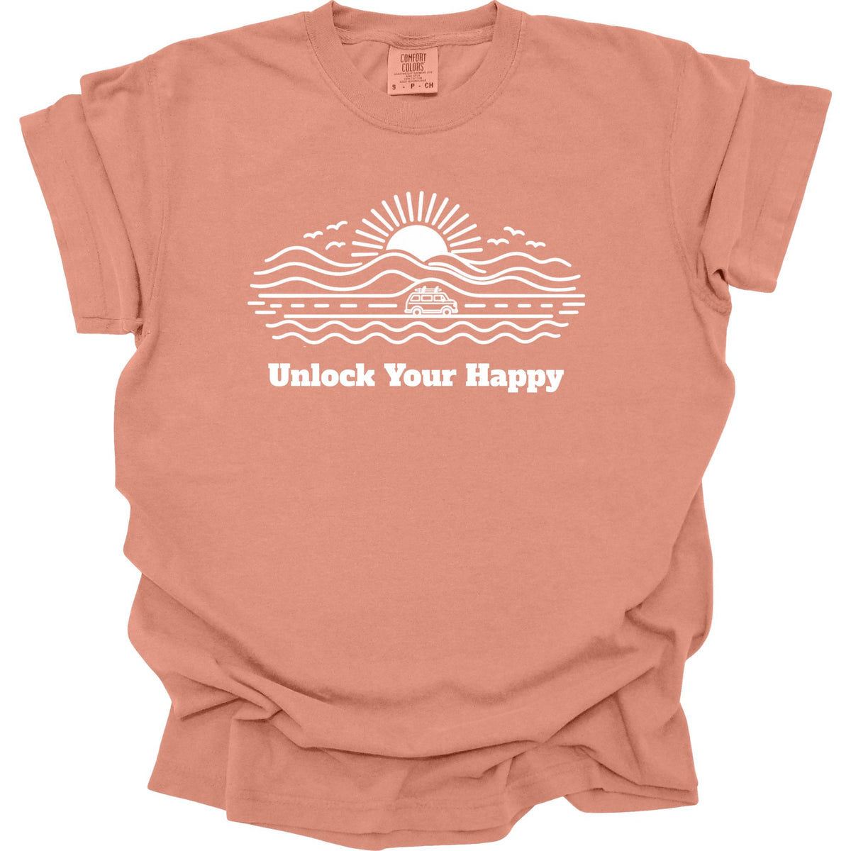 Camper van road trip Unlock Your Happy T-shirt in terracotta Comfort Colors with road, ocean, mountain scene and sun design