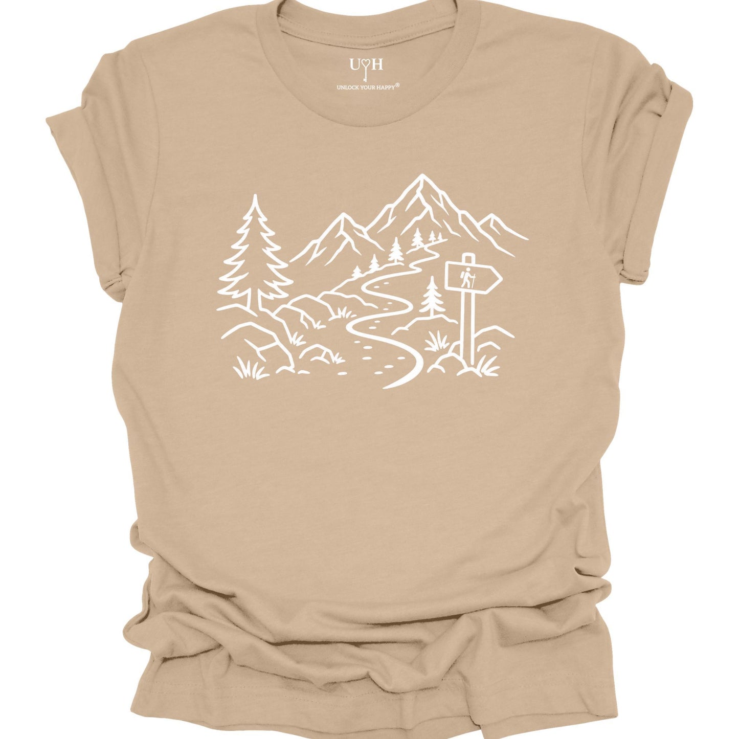 Minimalist tan t-shirt with white mountain and forest trail design, hiking path graphic for nature lovers and outdoor enthusiasts