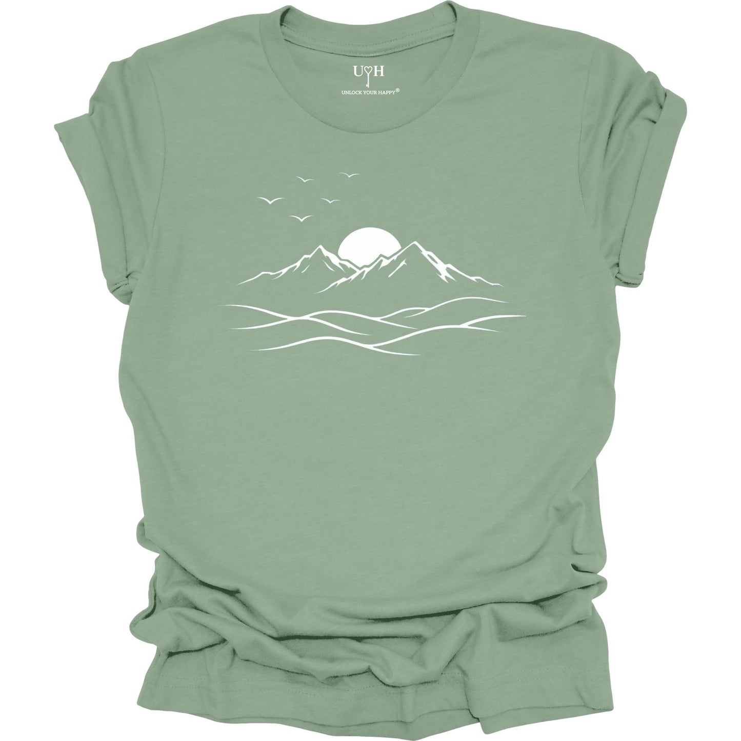 Sage t-shirt with a mountain and sun design on a white background
