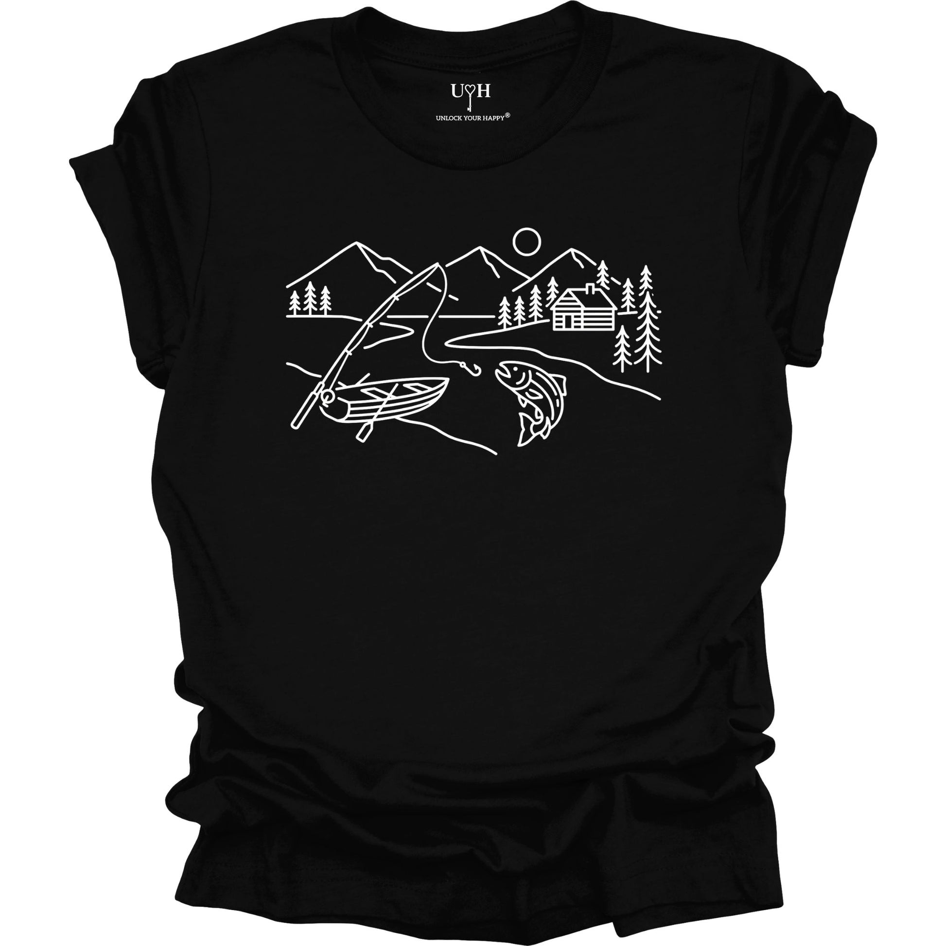 Black t-shirt featuring a minimalist white line art fishing design with mountains, river, canoe, fish, cabin, and pine trees.