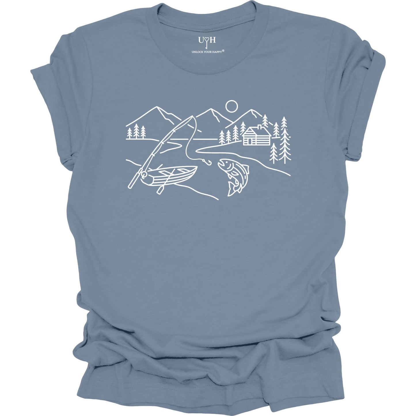 Blue t-shirt featuring a minimalist white line art fishing design with mountains, river, canoe, fish, cabin, and pine trees.