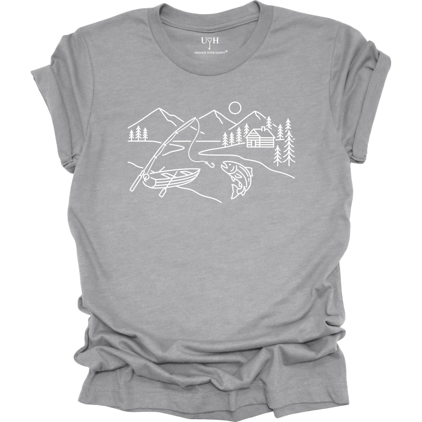 Gray t-shirt featuring a minimalist white line art fishing design with mountains, river, canoe, fish, cabin, and pine trees.