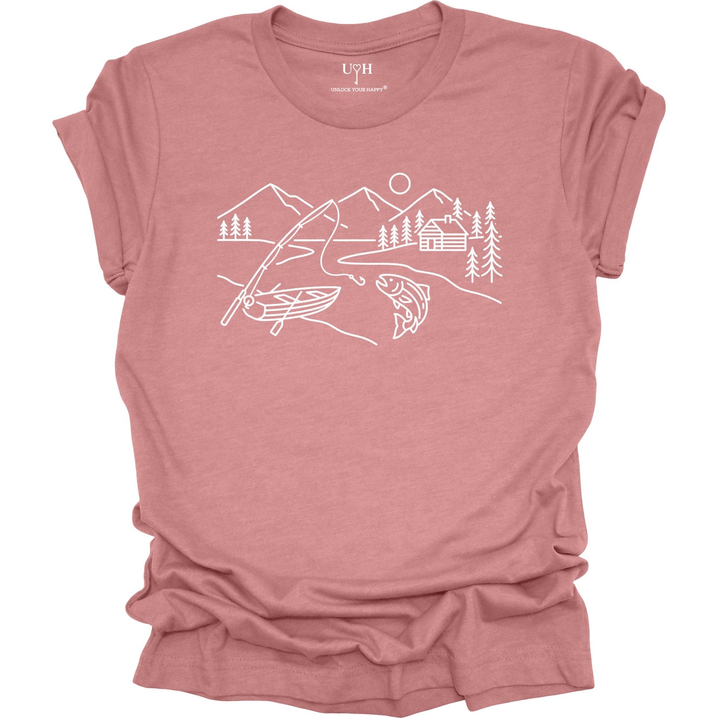 Mauve t-shirt featuring a minimalist white line art fishing design with mountains, river, canoe, fish, cabin, and pine trees.