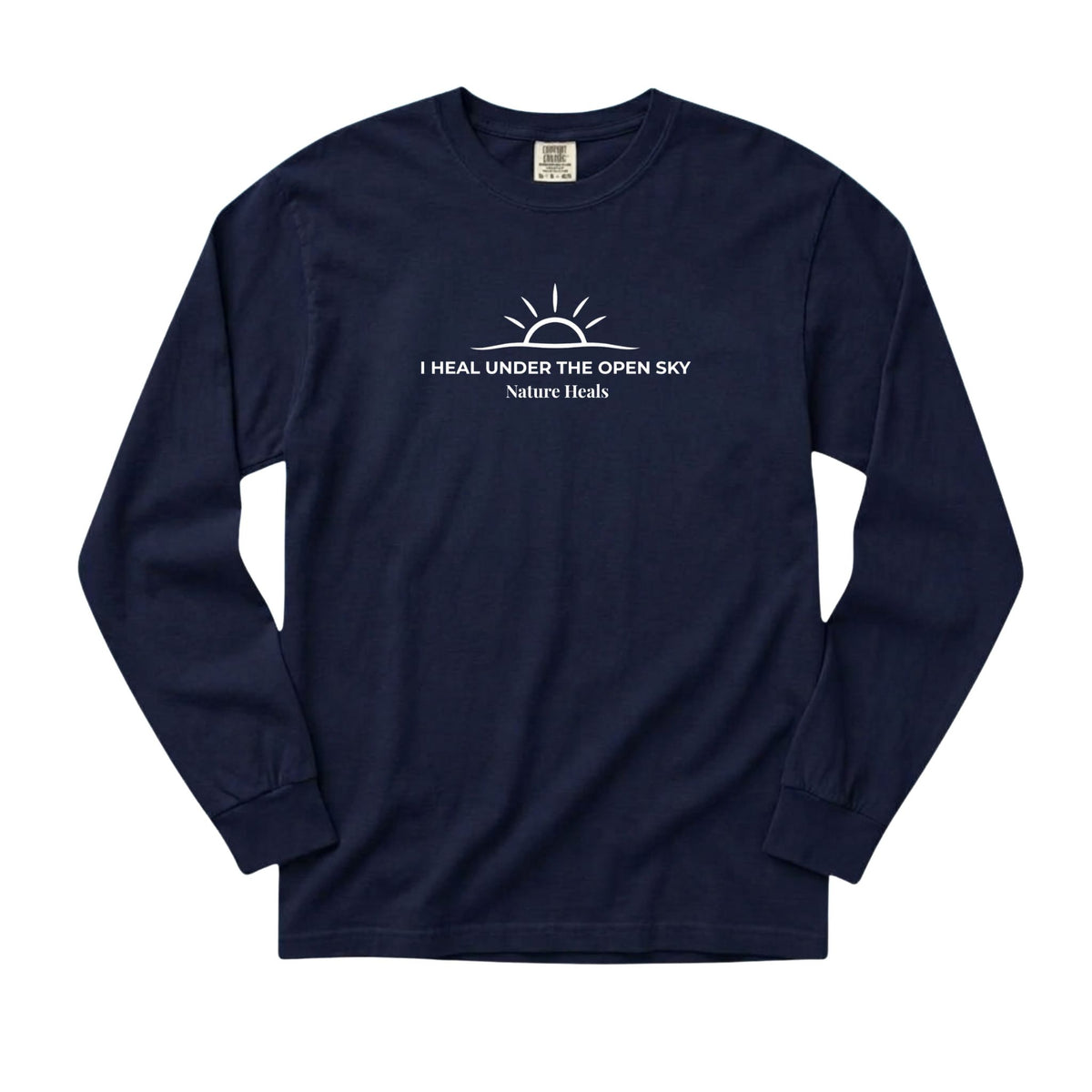 A navy blue long-sleeve t-shirt with a white graphic on the chest depicting a rising sun and the text 'I HEAL UNDER THE OPEN SKY Nature Heals'.