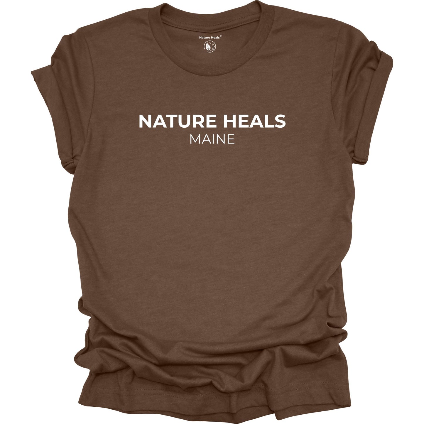 Brown t-shirt with 'Nature Heals Maine' text on a white background