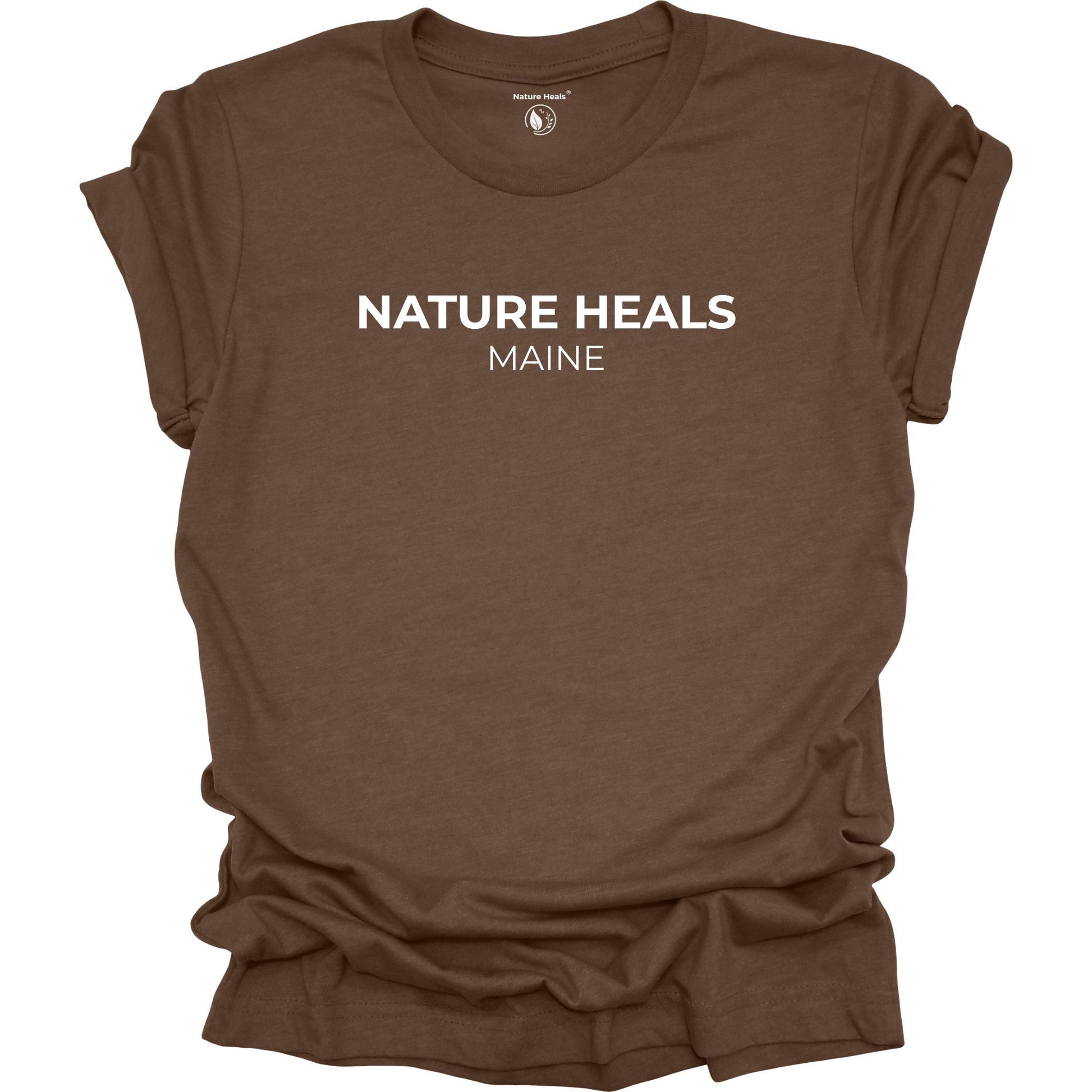 Brown t-shirt with 'Nature Heals Maine' text on a white background