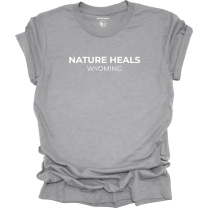 Gray t-shirt with 'Nature Heals Wyoming' text on a white background