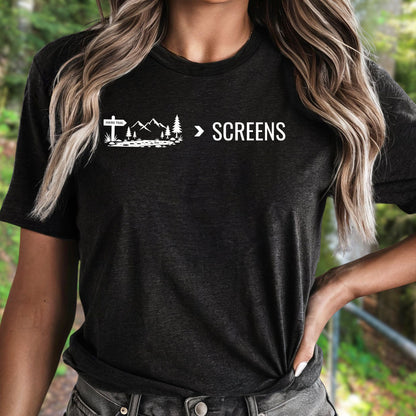 Female wearing a Nature Over Screens black t-shirt featuring mountains and trees 