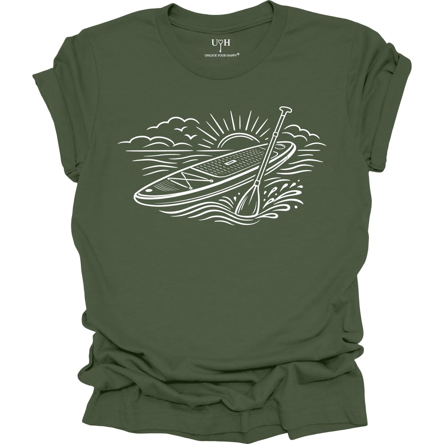 Green t-shirt featuring white line art of a stand up paddle board with paddle on water at sunrise, worn by model, ocean and beach lifestyle design