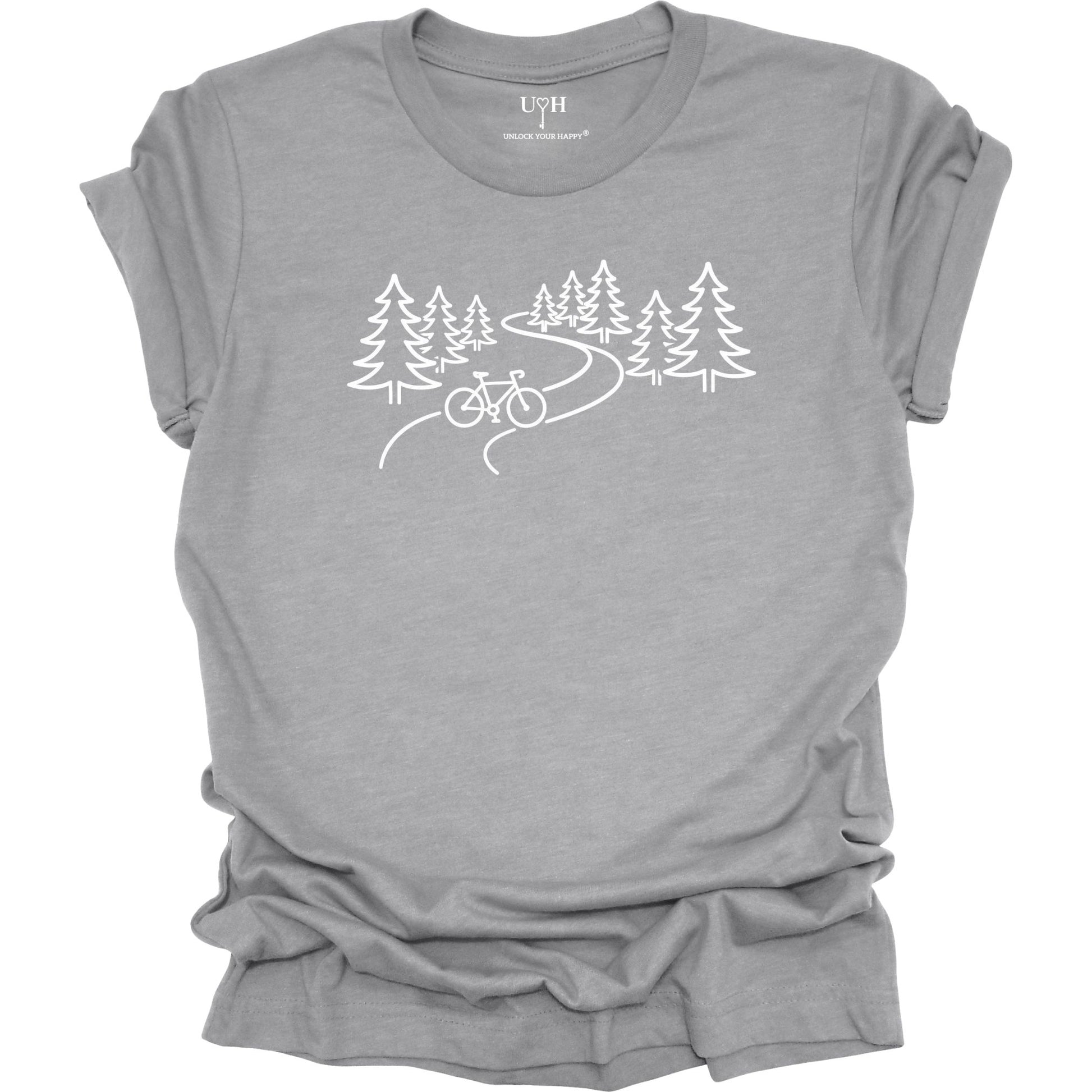 Nature biking graphic gray t-shirt with minimalist forest trail and bicycle design, featuring “unlock your happy” text on sleeve