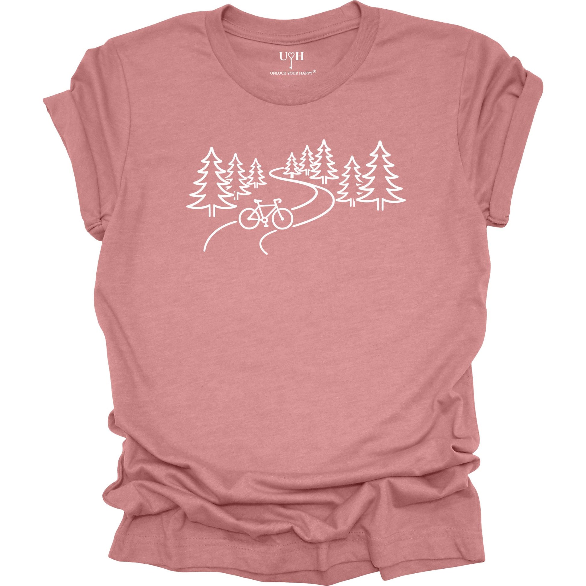 nature biking graphic mauve t-shirt with minimalist forest trail and bicycle design, featuring “unlock your happy” text on sleeve