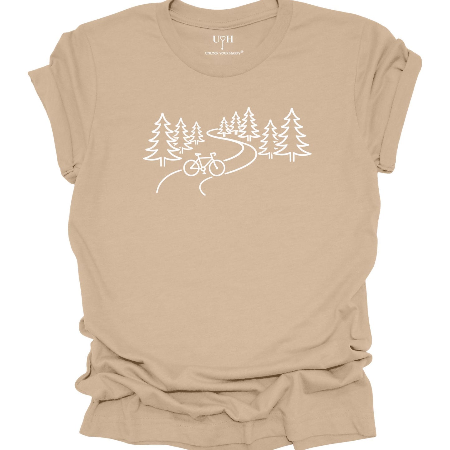 nature biking graphic tan t-shirt with minimalist forest trail and bicycle design, featuring “unlock your happy” text on sleeve