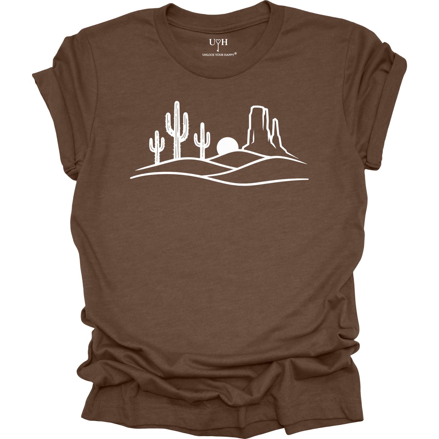 Brown t-shirt with white desert landscape graphic on a white background