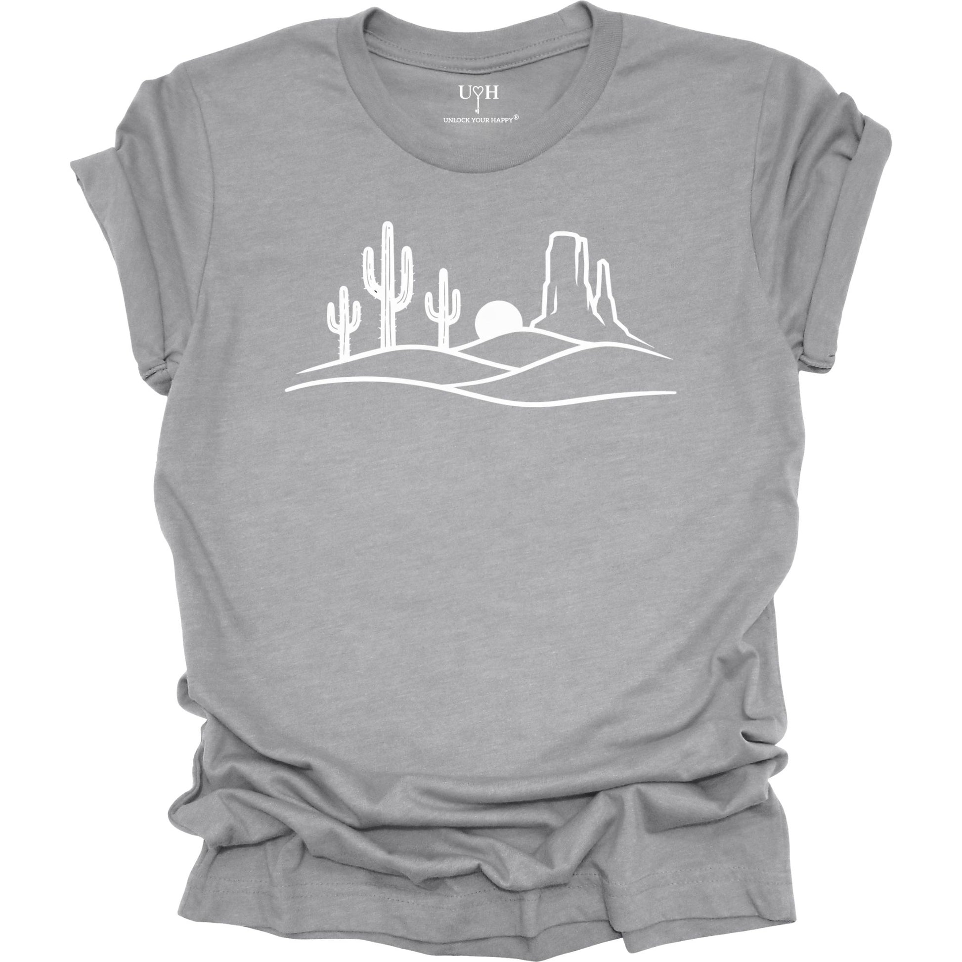 Gray t-shirt with a white desert landscape graphic on a white background