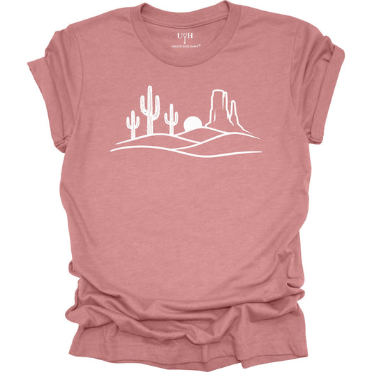 Mauve t-shirt with a white desert landscape graphic on a white background