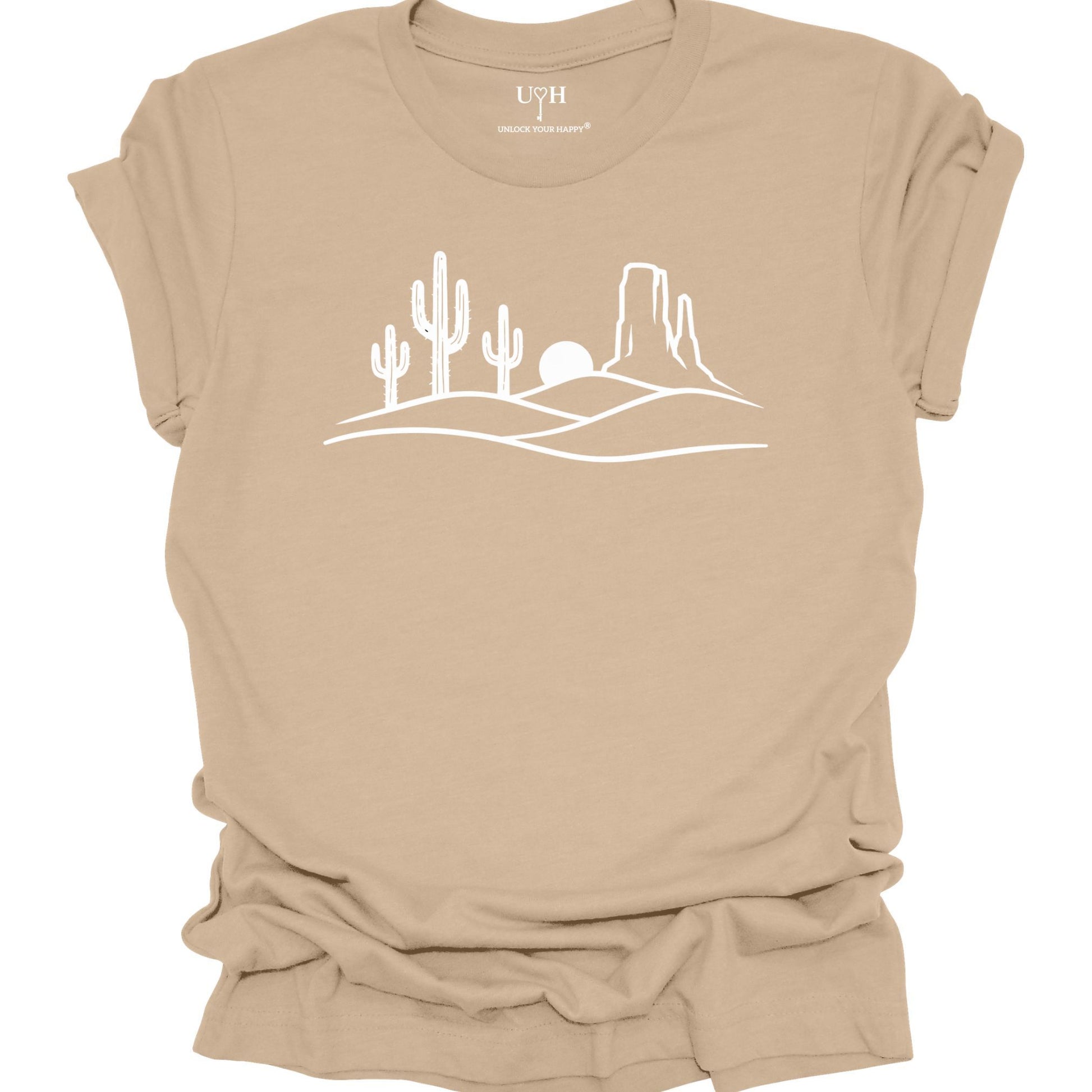 Tan  t-shirt with a white desert landscape graphic on a white background