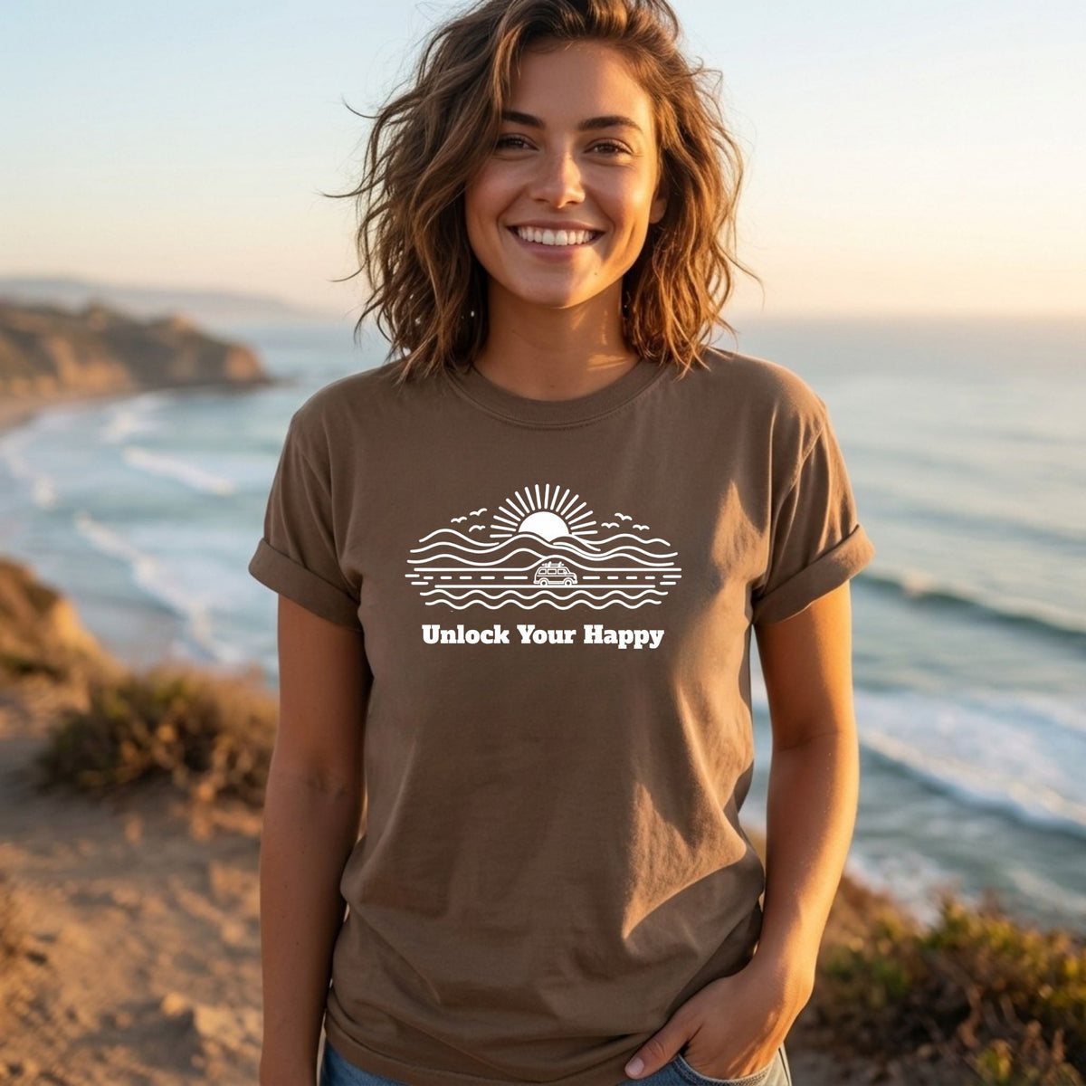Unlock Your Happy camper van road trip T-shirt in espresso brown Comfort Colors with nature and sun design on female near ocean