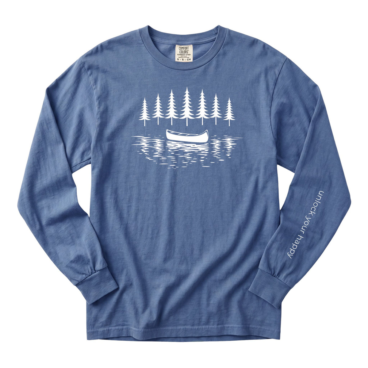 A blue long-sleeve t-shirt with a white graphic of a canoe on water in front of pine trees, featuring the text 'unlock your happy' printed down the left sleeve.