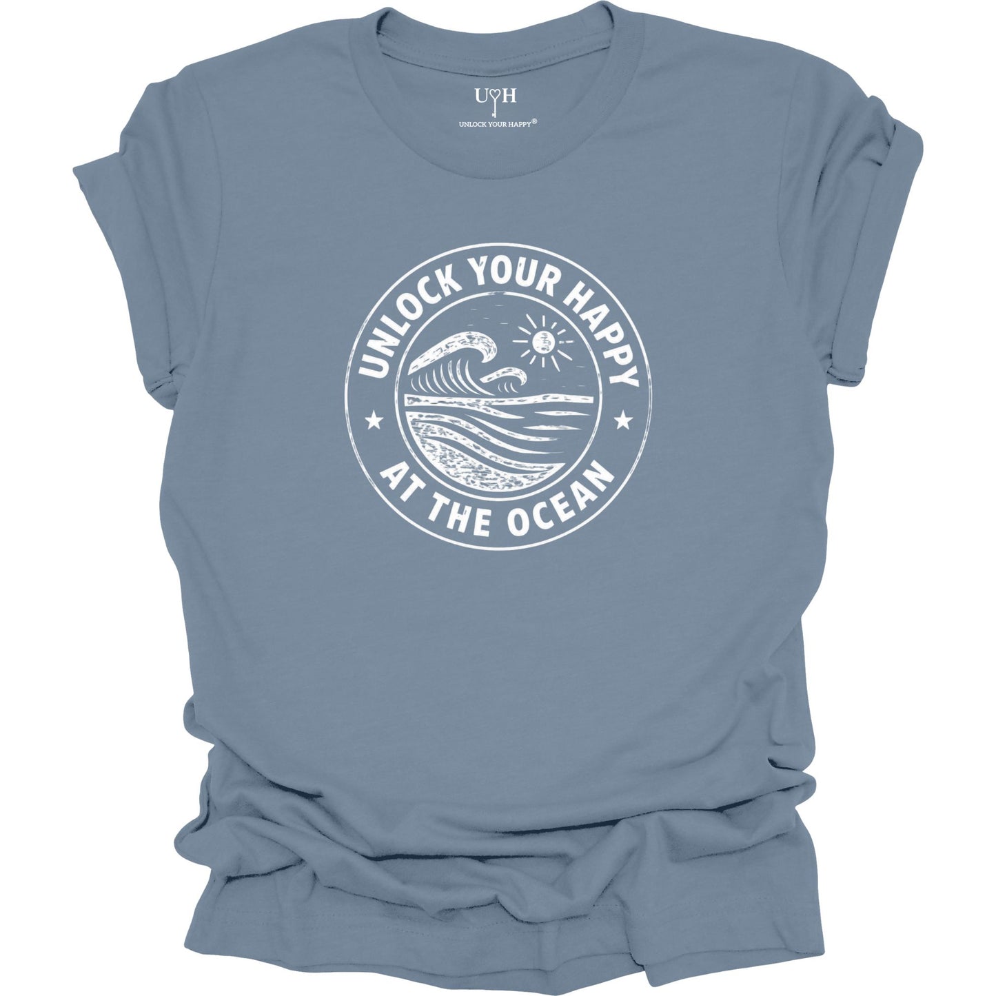 Unlock Your Happy at the Ocean graphic blue t-shirt featuring a vintage wave and sun coastal design