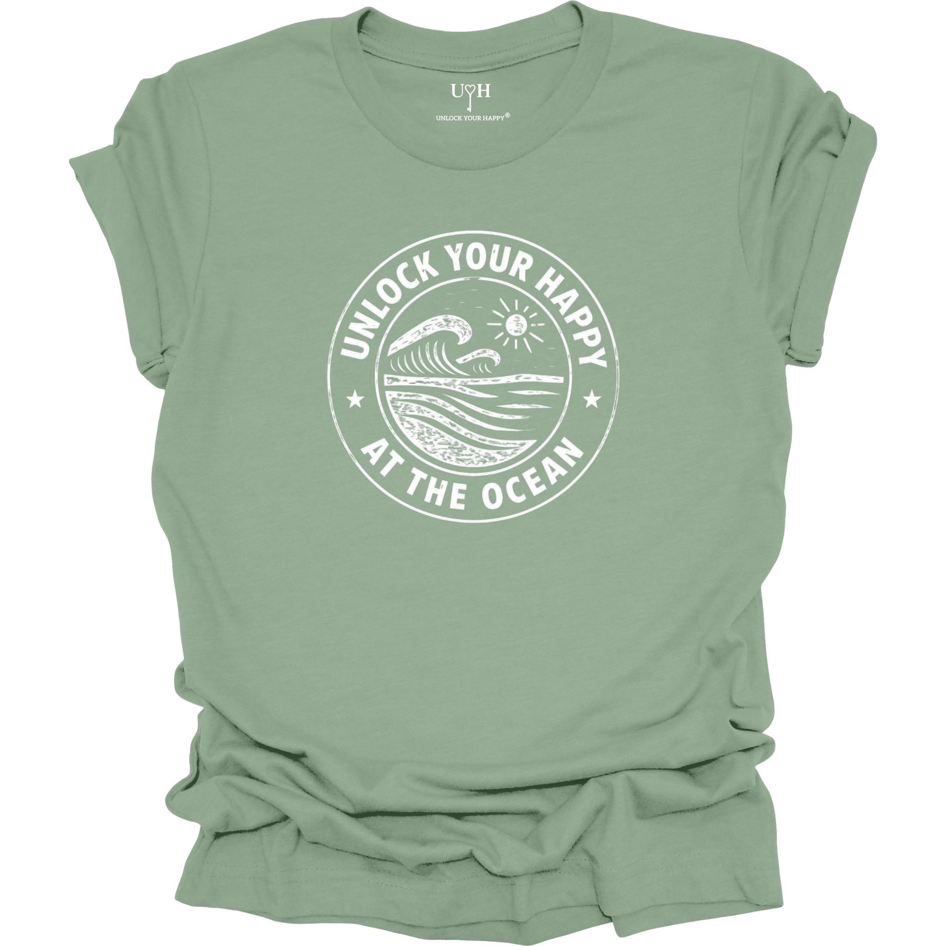 Unlock Your Happy at the Ocean graphic sage t-shirt featuring a vintage wave and sun coastal design