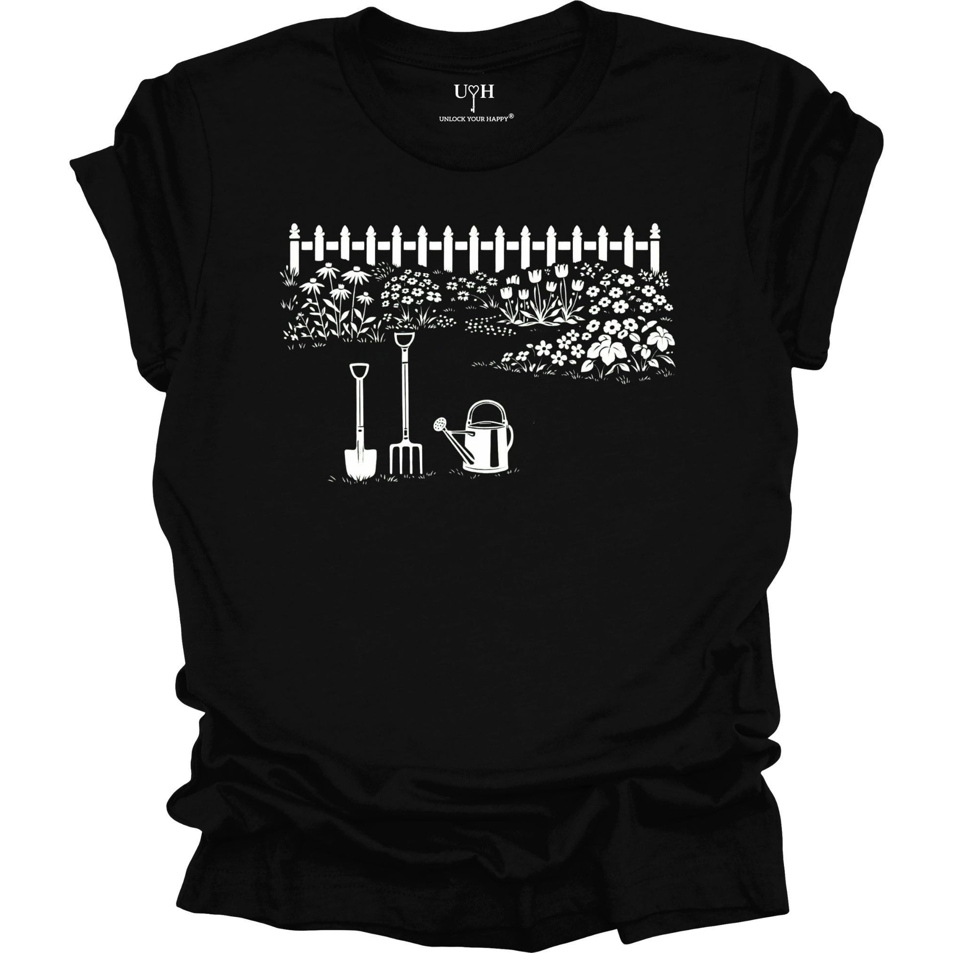 White gardening graphic on a black t-shirt featuring garden tools and flower garden illustration with nature-inspired design 