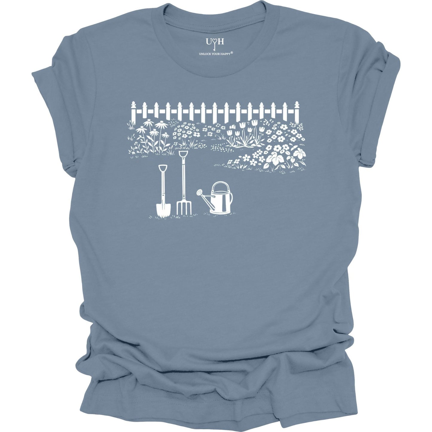 White gardening graphic on a blue t-shirt featuring garden tools and flower garden illustration with nature-inspired design 