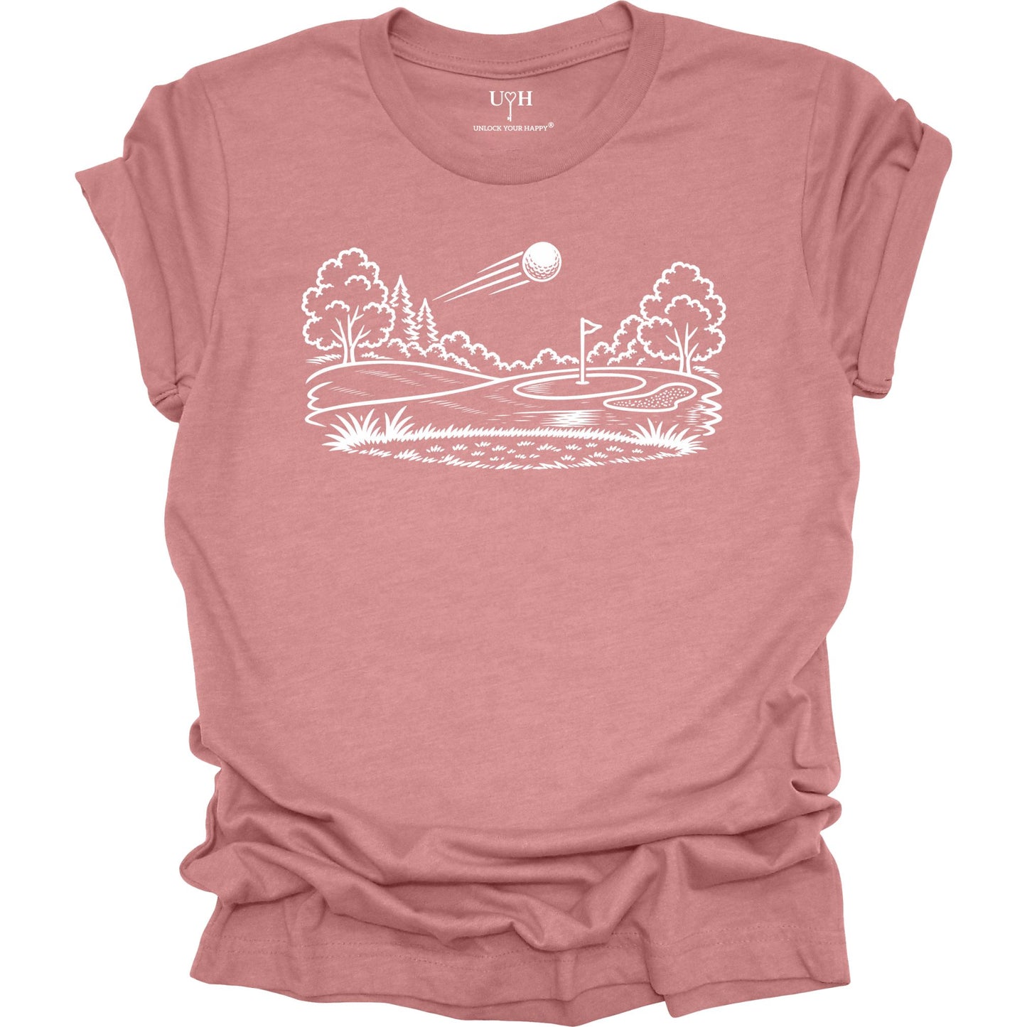 Minimalist golf course graphic t-shirt with line art design of golf ball and green on soft unisex mauve tee