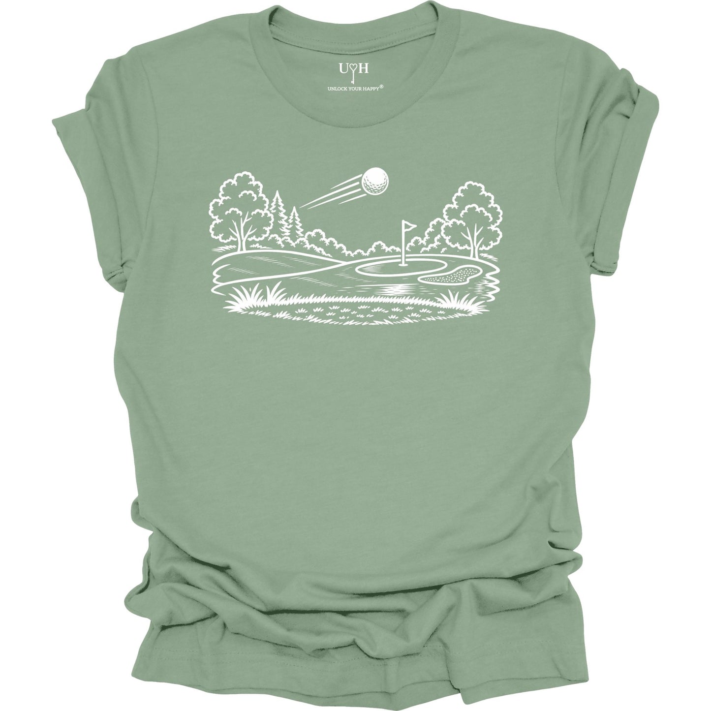 Minimalist golf course graphic t-shirt with line art design of golf ball and green on soft unisex sage green tee