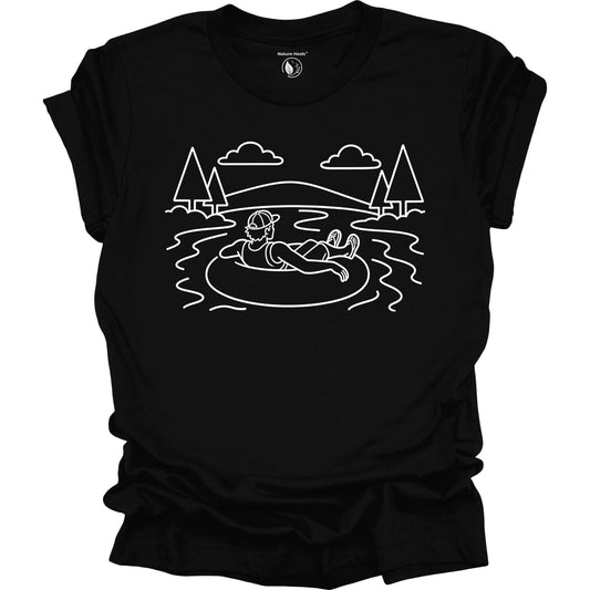 Black t-shirt with white graphic of a male tubing in a lake with trees and mountains.