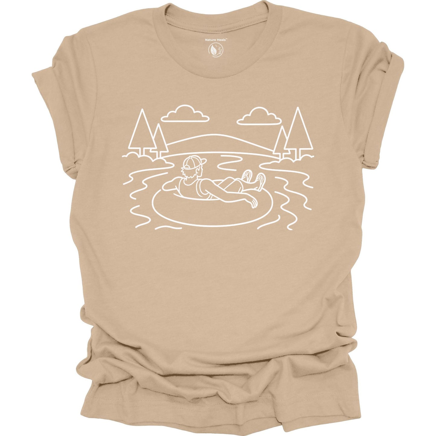 Tan t-shirt with white line art of a person in a lake and trees white line art