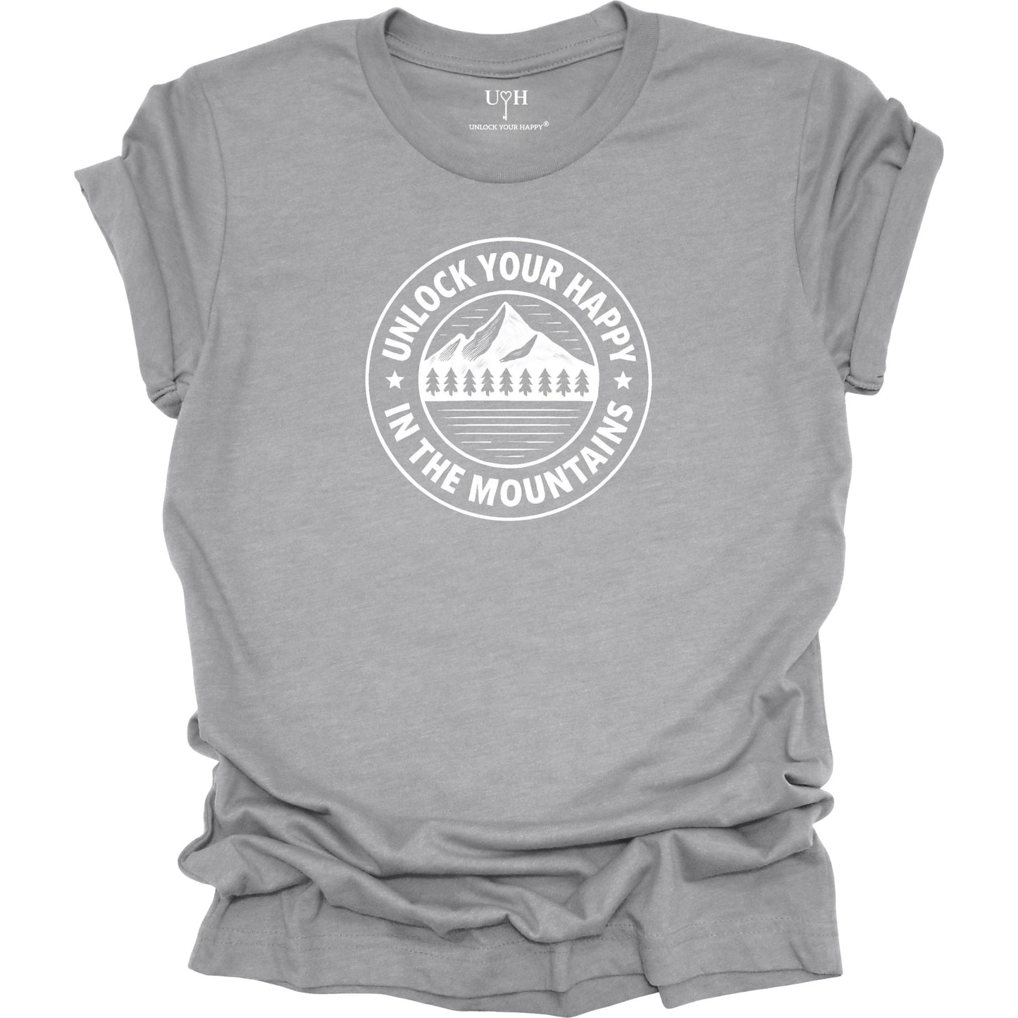 Gray unisex graphic t-shirt featuring a circular mountain and pine tree design with the text “Unlock Your Happy in the Mountains”.