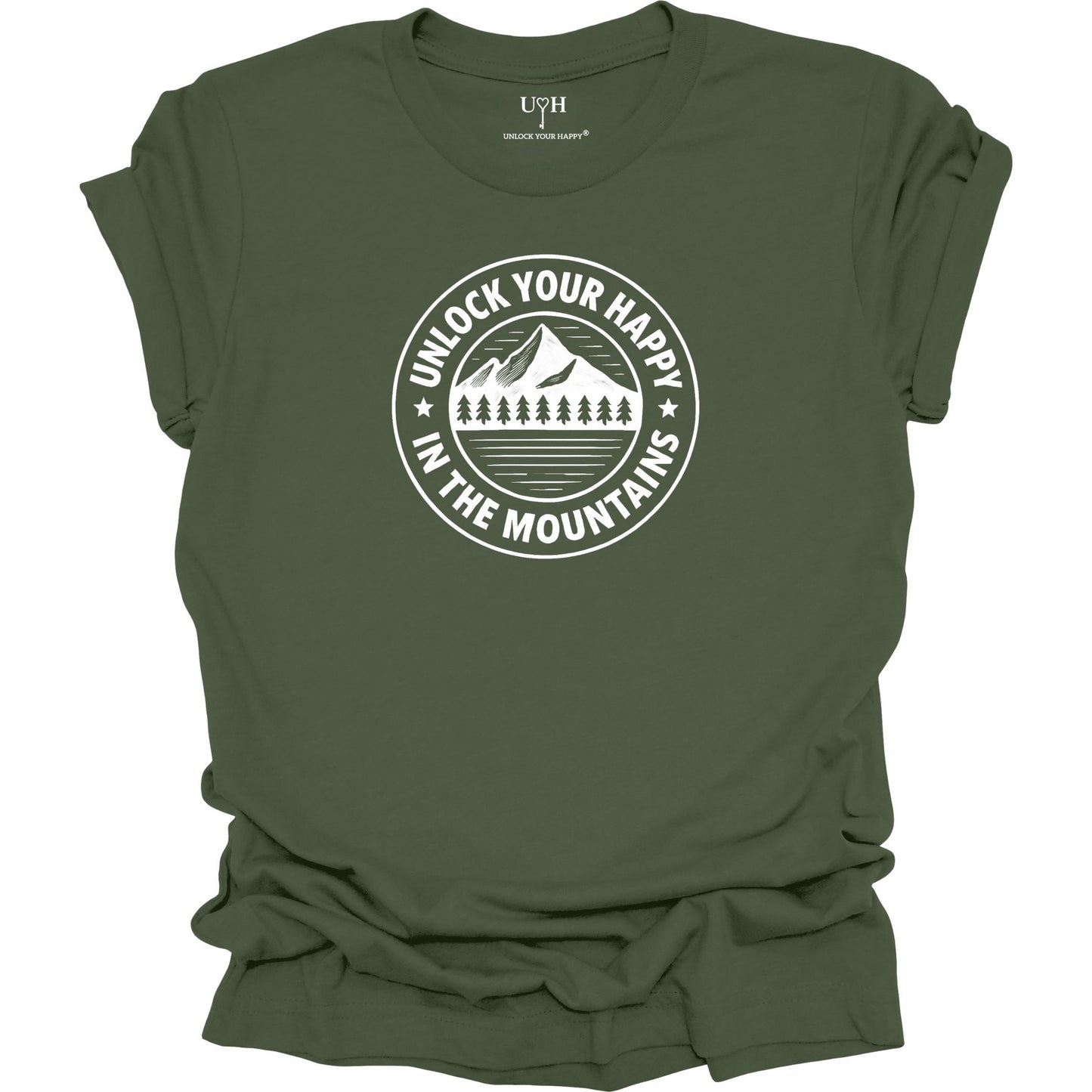 Green unisex graphic t-shirt featuring a circular mountain and pine tree design with the text “Unlock Your Happy in the Mountains”.