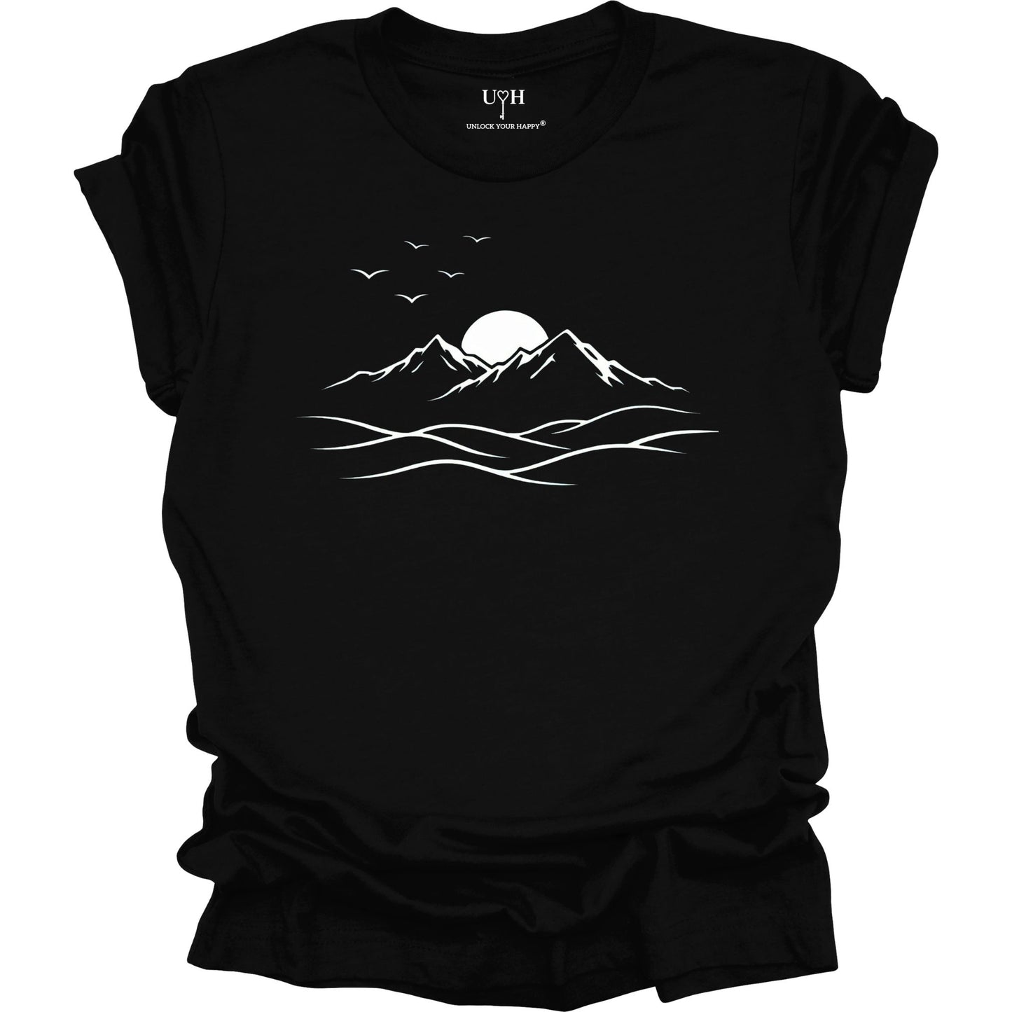 Black t-shirt with white mountain and sunset design on a white background