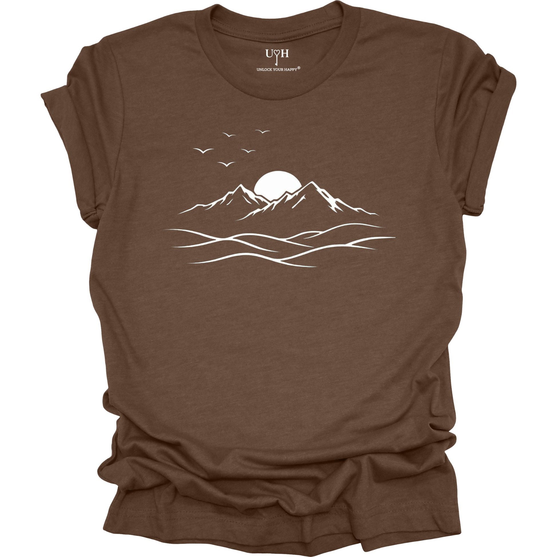 Brown t-shirt with white mountain and sun design on a white background