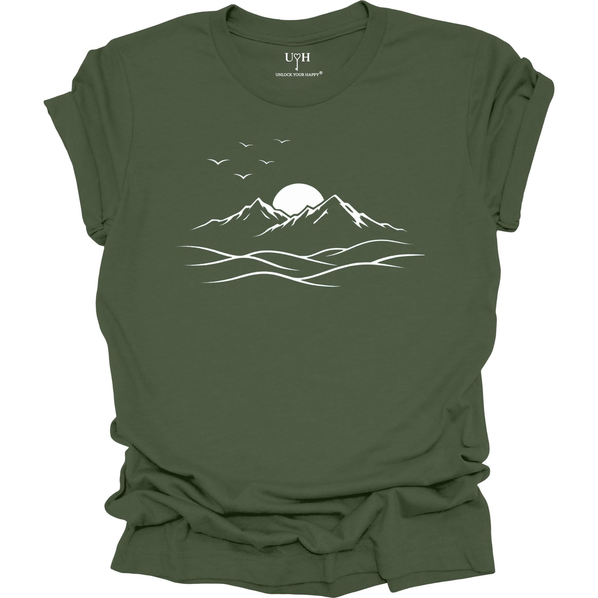 Green t-shirt with mountain and sun design on a white background