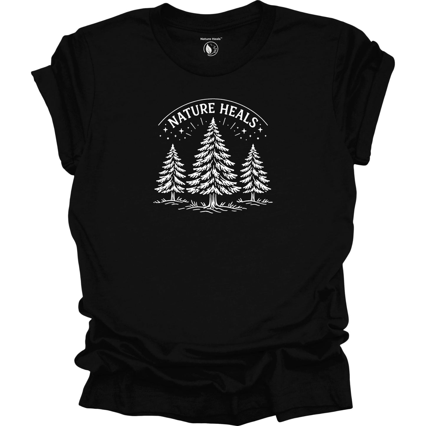 Minimalist Nature Heals t-shirt with pine tree graphic on black fabric, designed for nature lovers, wellness, and outdoor lifestyle