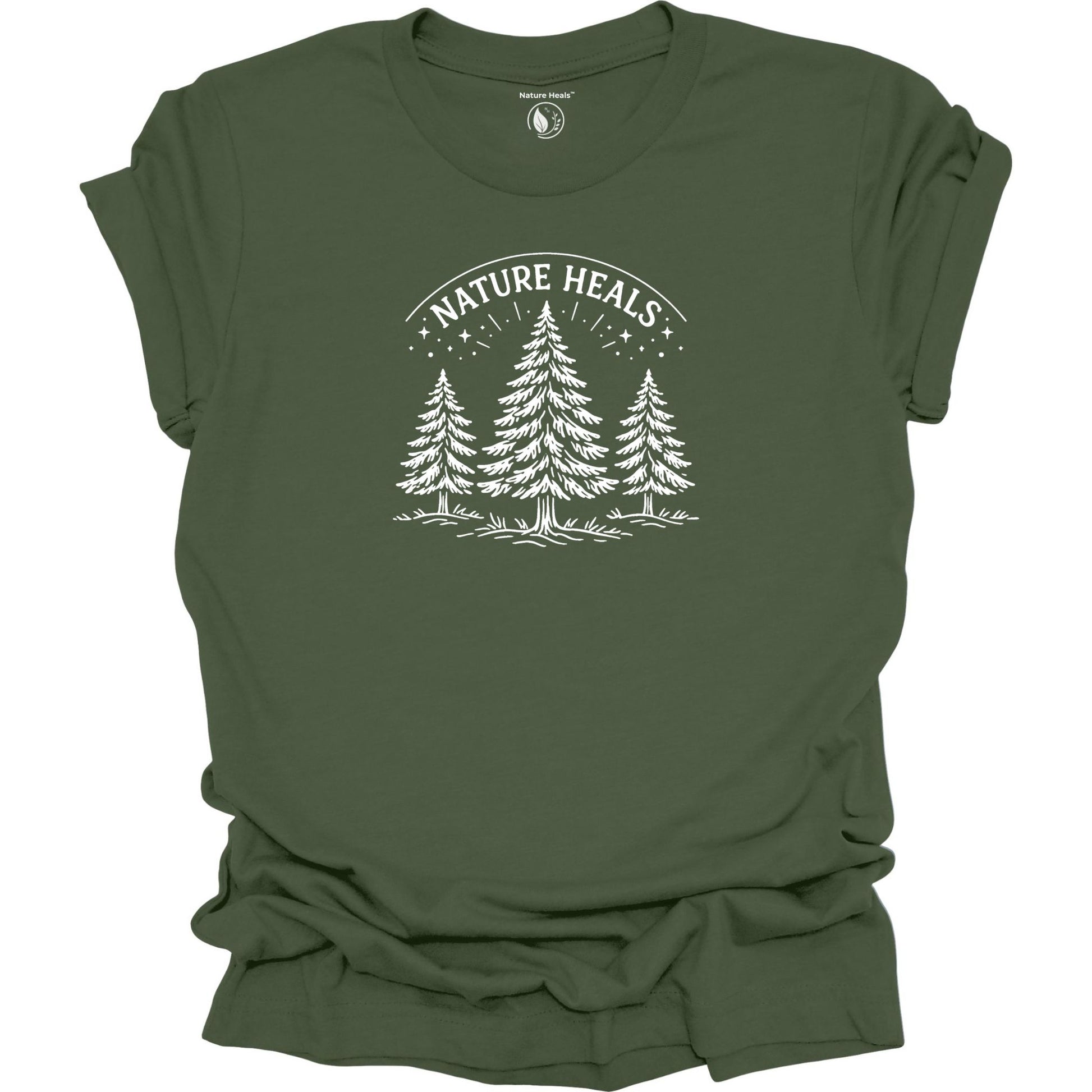 Minimalist Nature Heals t-shirt with pine tree graphic on  green fabric, designed for nature lovers, wellness, and outdoor lifestyle