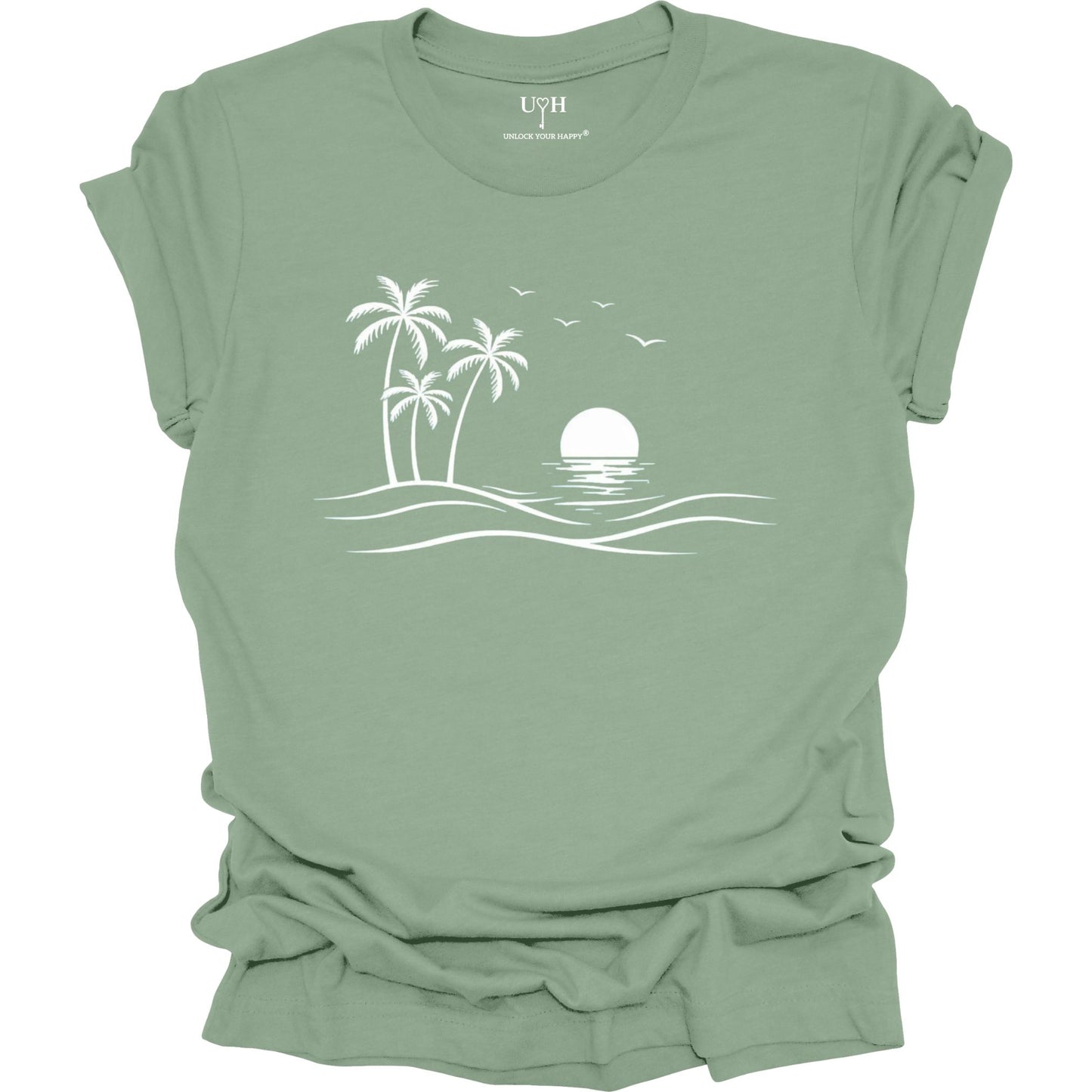 Sage t-shirt with a white beach graphic on a white background