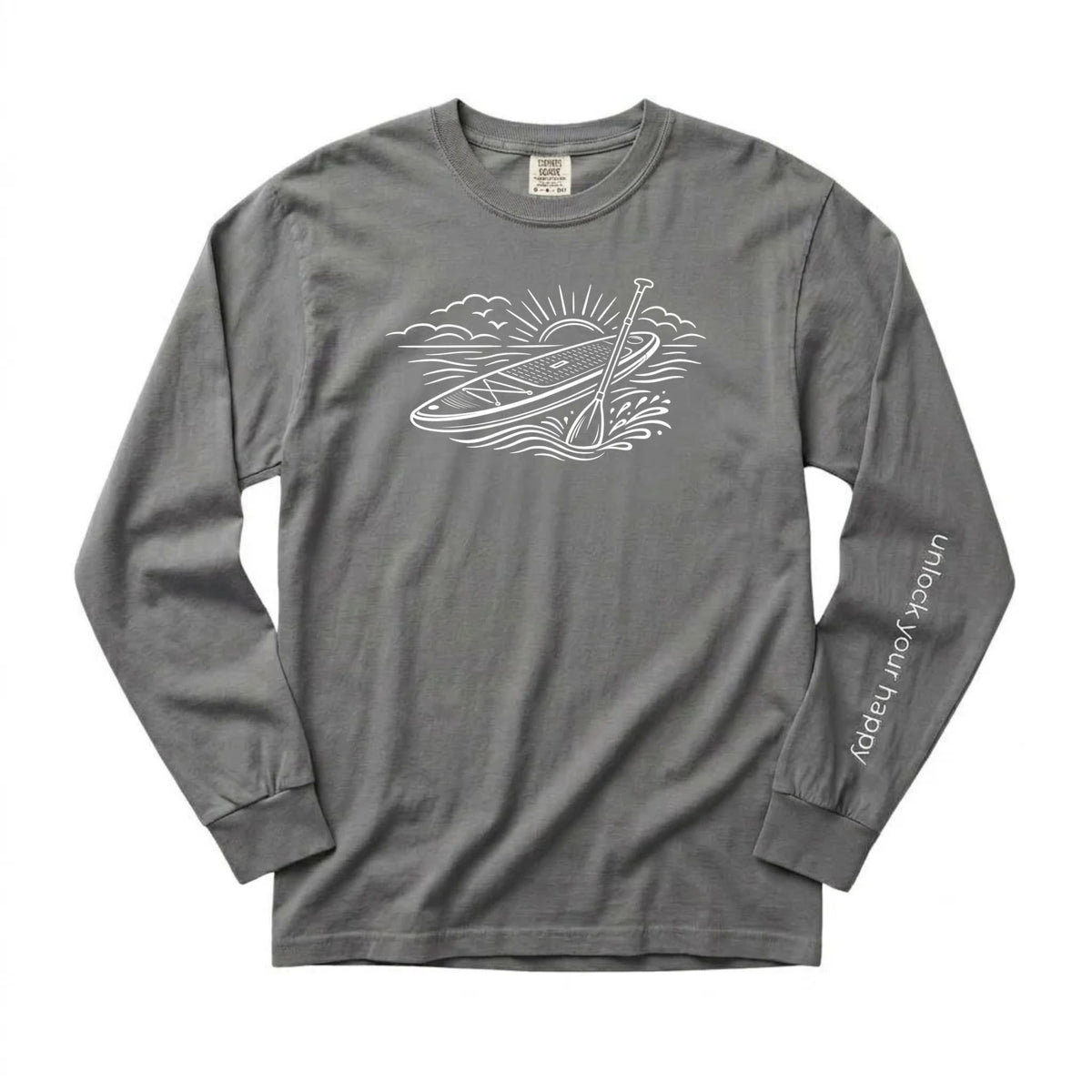 Unlock Your Happy paddleboard long sleeve shirt featuring a white paddleboard and sunrise graphic on a grey Comfort Colors tee