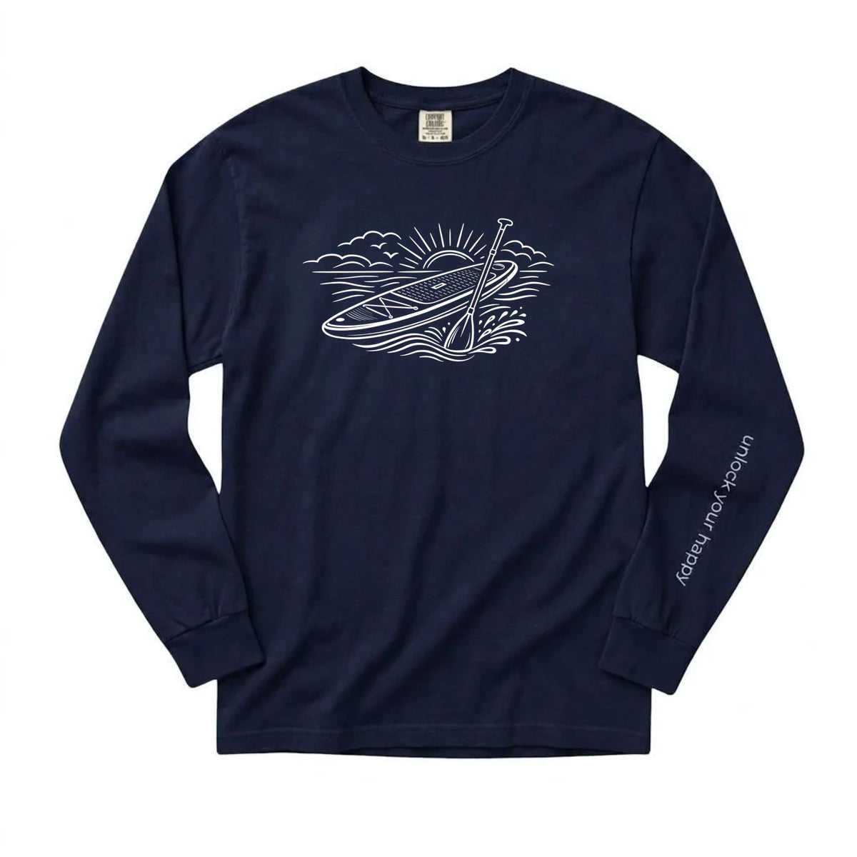 Unlock Your Happy paddleboard long sleeve shirt featuring a white paddleboard and sunrise graphic on a navy-blue Comfort Colors tee