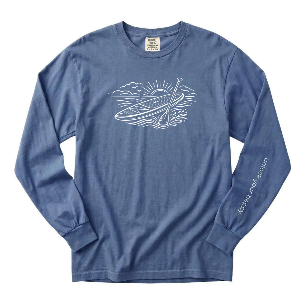 Unlock Your Happy paddleboard long sleeve shirt featuring a white paddleboard and sunrise graphic on a blue jean colored Comfort Colors tee