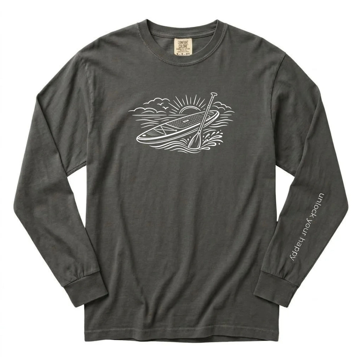 Unlock Your Happy paddleboard long sleeve shirt featuring a white paddleboard and sunrise graphic on a pepper grey  Comfort Colors tee