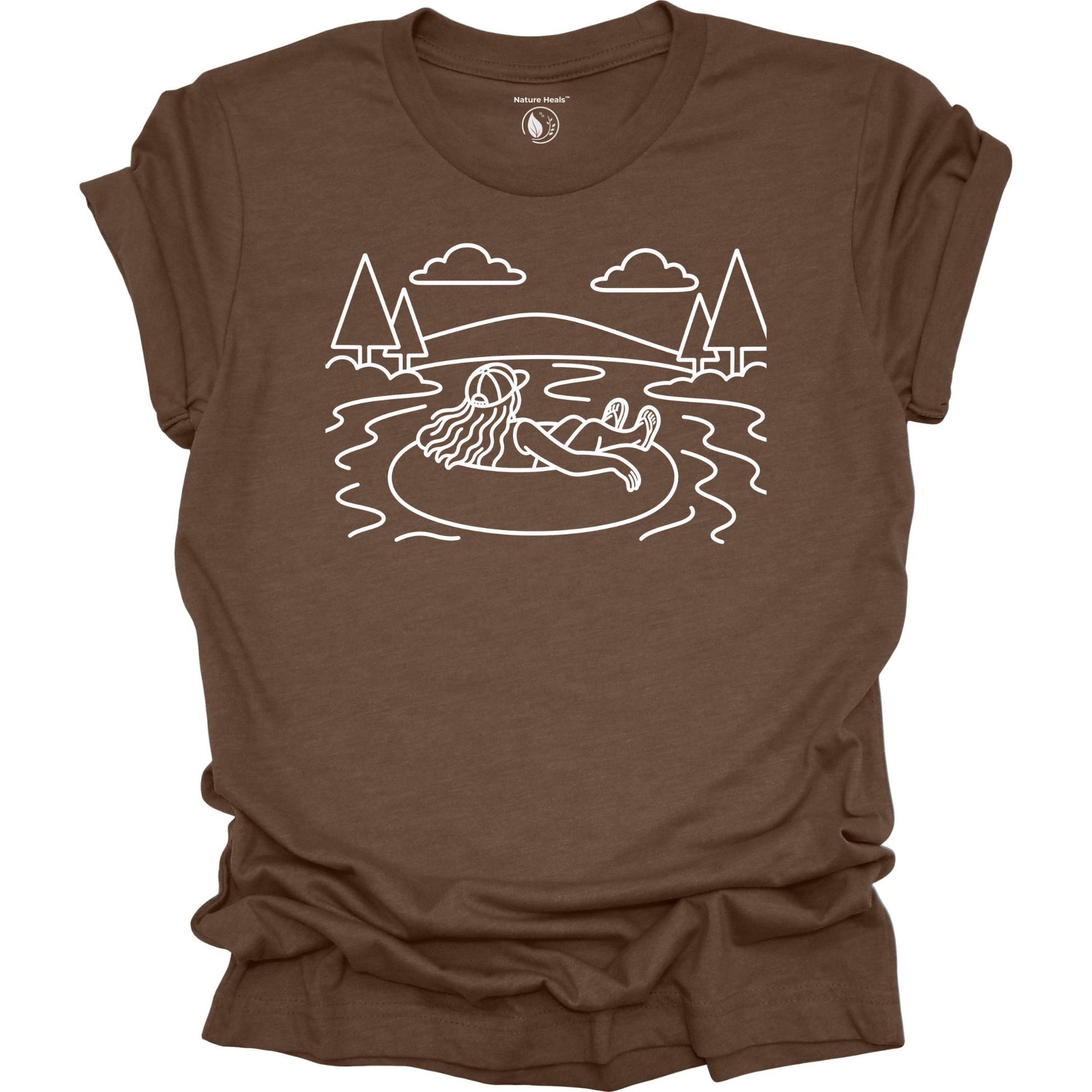 Nature Heals river tubing graphic brown t-shirt with minimalist outdoor water and tree line art design