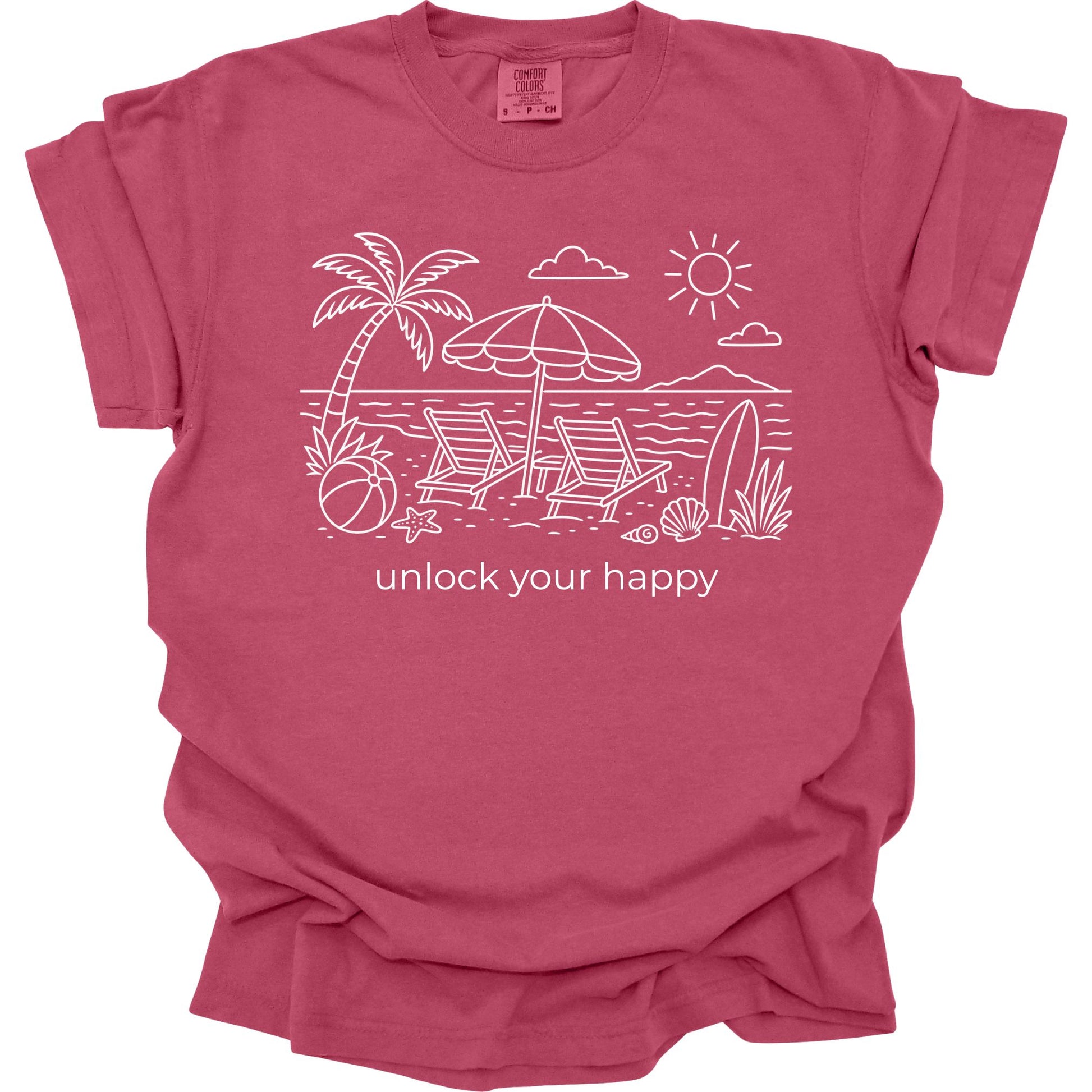Brick colored  t-shirt with beach graphic and 'unlock your happy' text on a white background