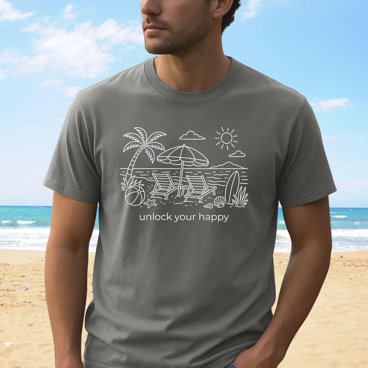 Man wearing a gray t-shirt with beach graphics and text on a beach background