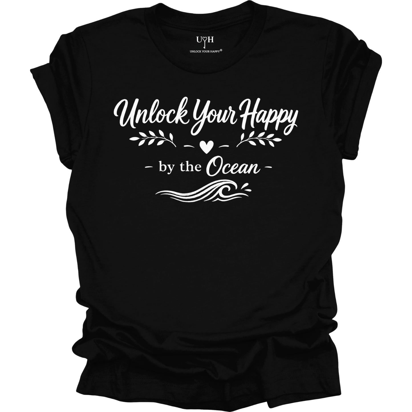 Black t-shirt with white text 'Unlock Your Happy by the Ocean' on a white background