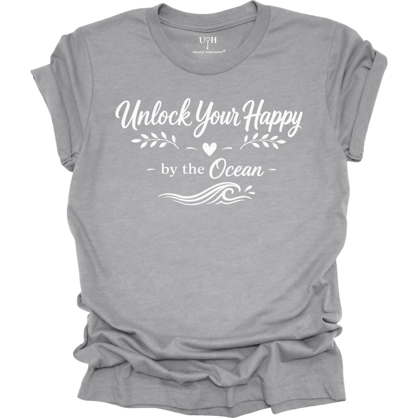 Gray t-shirt with 'Unlock Your Happy by the Ocean' text on a white background