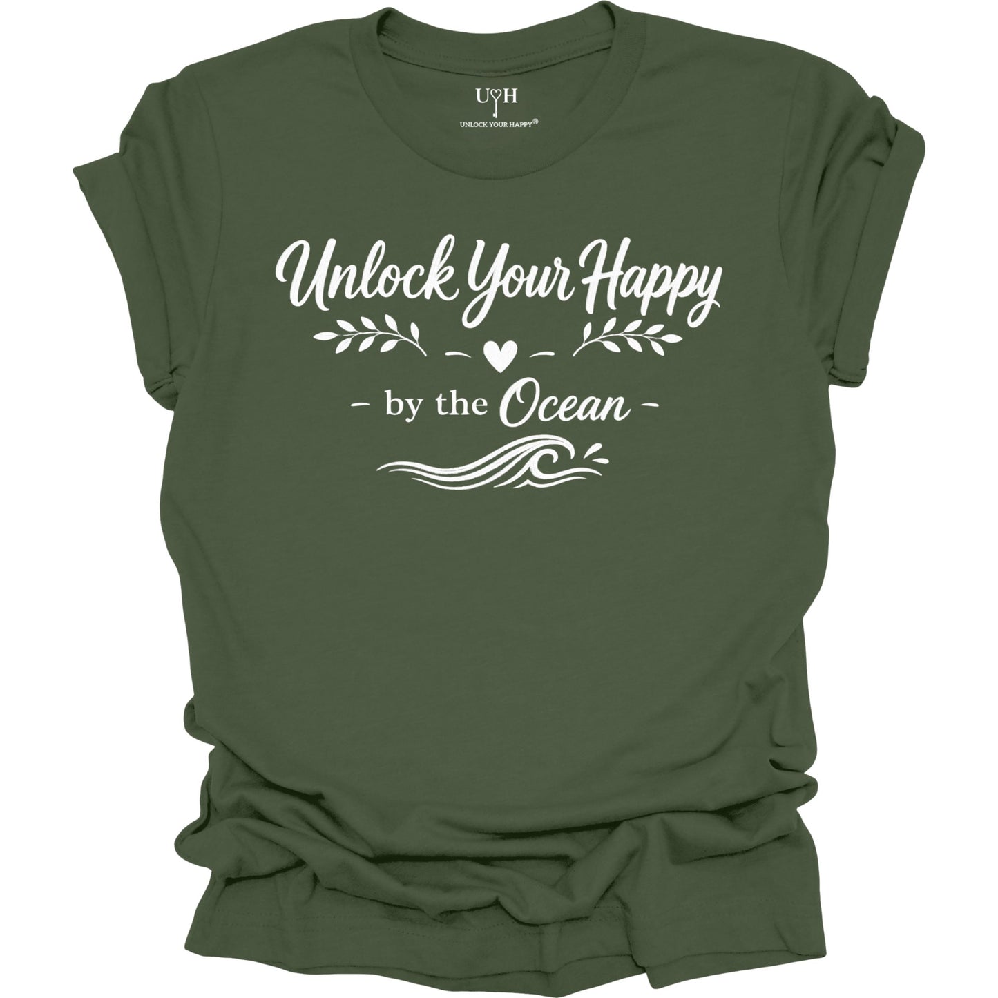 Green t-shirt with white text 'Unlock Your Happy by the Ocean' on a white background