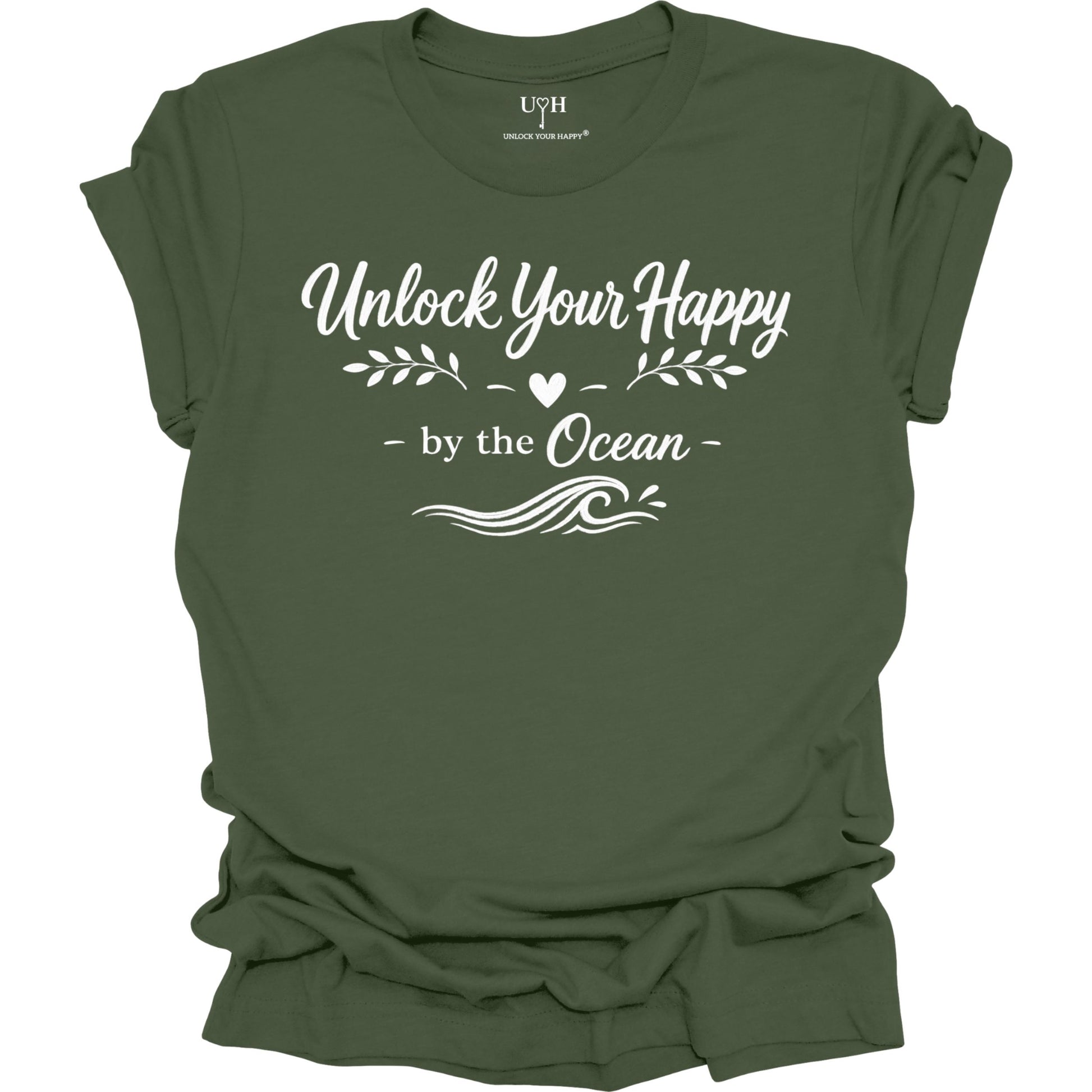 Green t-shirt with white text 'Unlock Your Happy by the Ocean' on a white background