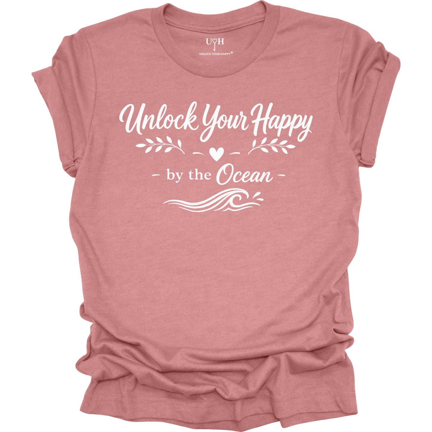 Mauve t-shirt with 'Unlock Your Happy by the Ocean' text on a white background